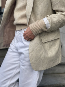 Cream tweed blazer.