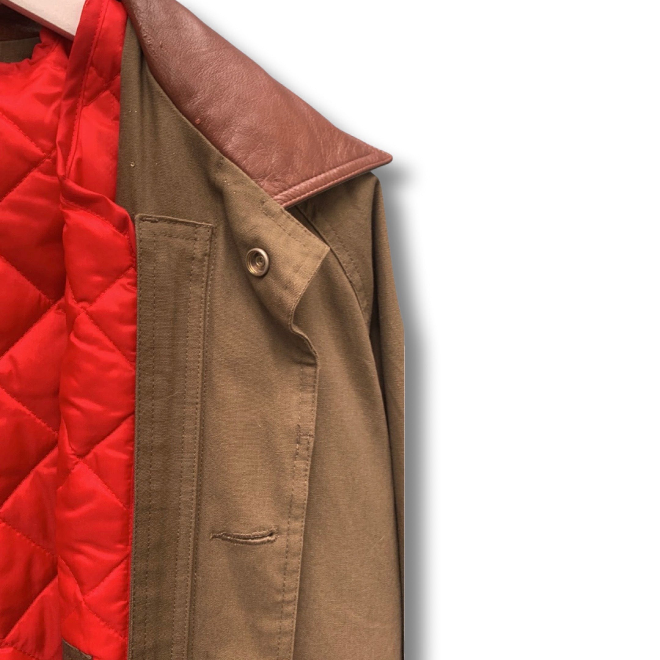 Long khaki brown vintage coat with quilted inner red jacket.