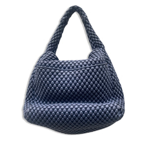 Tissa Fontaneda blue leather bag.