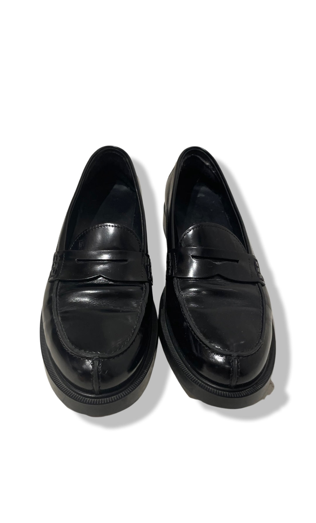 Black loafers by Tod's.